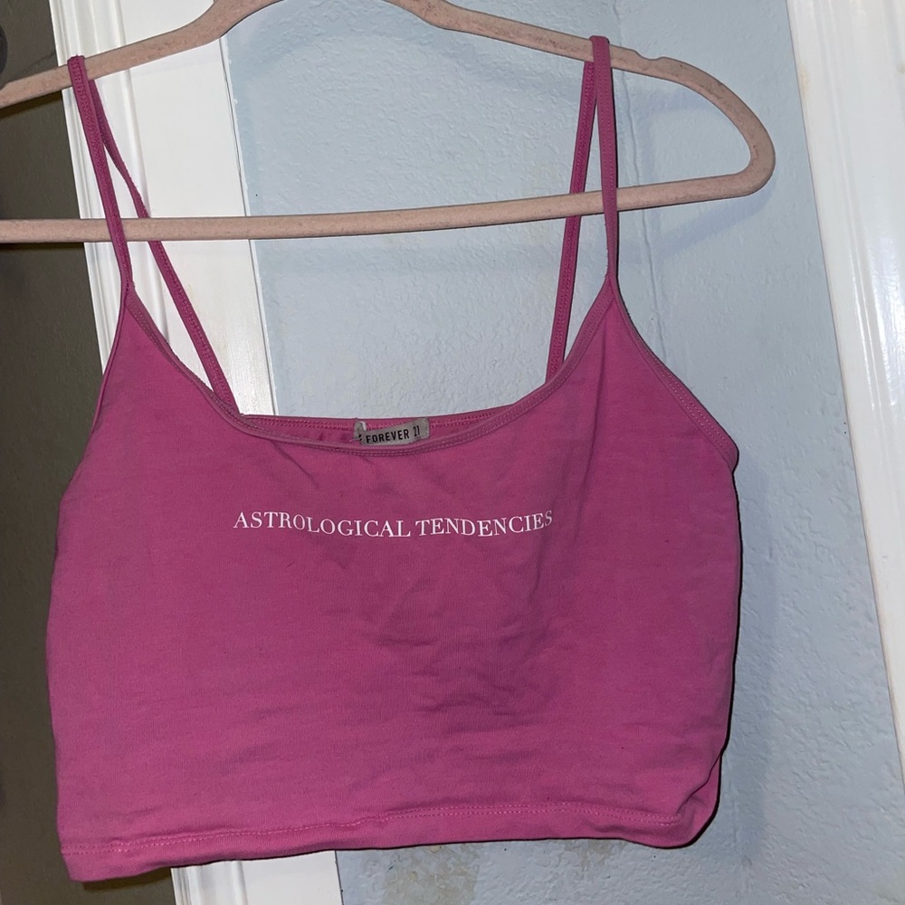 Pink cropped “ astrological tendencies-not in your cards” tank